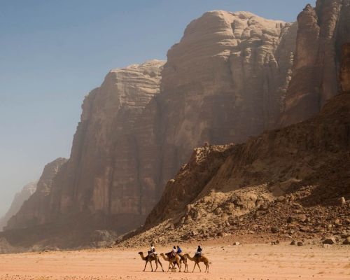 Camel ride at sunset near Wadi Rum camp before starting an adventurous jeep tour