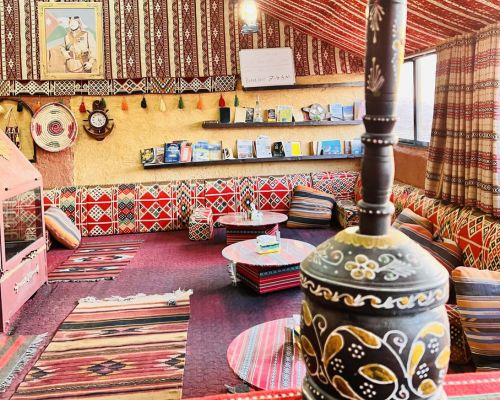 Wadi Rum camp illuminated by sunset after a day of jeep touring and camel riding