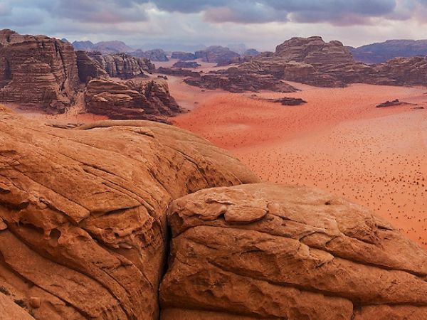 Jebel Hash hike from Wadi Rum camp through scenic desert valleys and cliffs