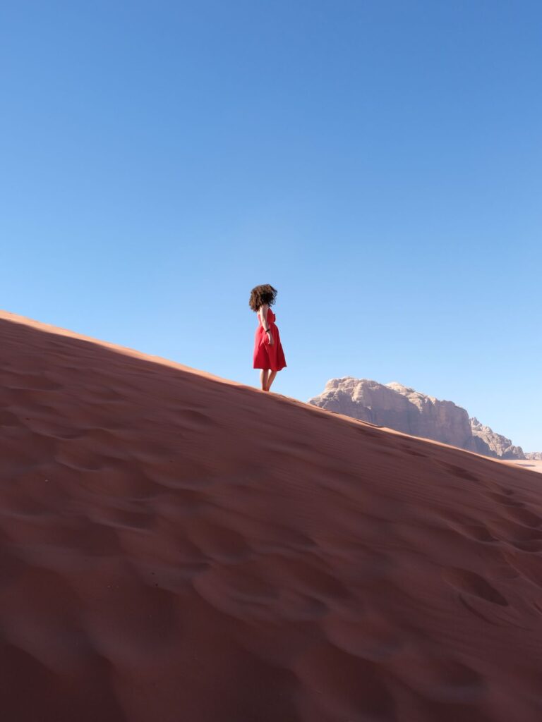 Experience the rugged beauty of Wadi Rum during an exciting jeep tour across desert dunes and rock formations