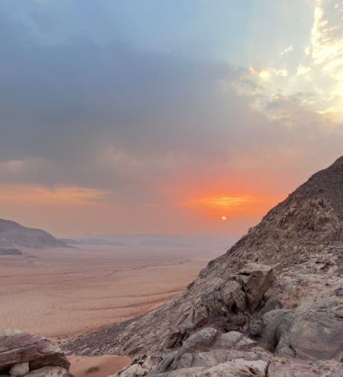 One day two night Wadi Rum jeep tour exploring desert vistas, rock formations, and night camping under the stars