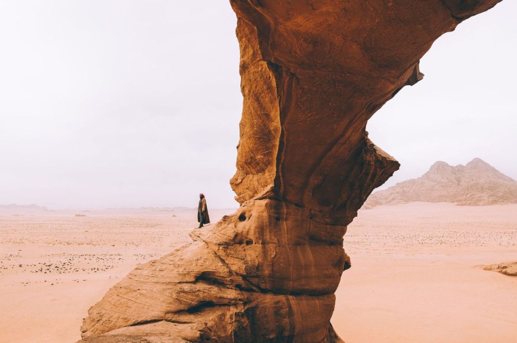 Guided hike from Wadi Rum camp exploring rocky desert terrain.